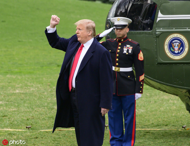 United States President Donald J. Trump gestures towards supporters as he prepares to board Marine One after taking questions from the media as he departs the White House in Washington, DC for a weekend in Mar-a-Lago, Florida on Friday, March 22, 2019. [Photo: IC]