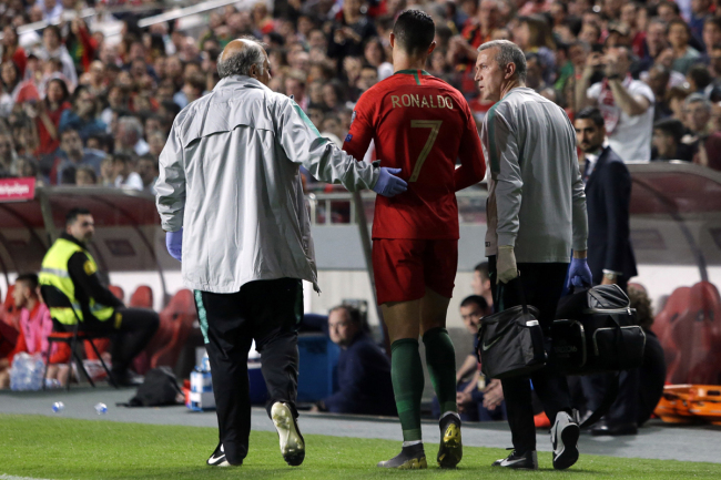 Portugal's Cristiano Ronaldo leaves the pitch during the Euro 2020 group B qualifying soccer match between Portugal and Serbia at the Luz stadium in Lisbon, Portugal, Monday, March 25, 2019. [Photo: AP]