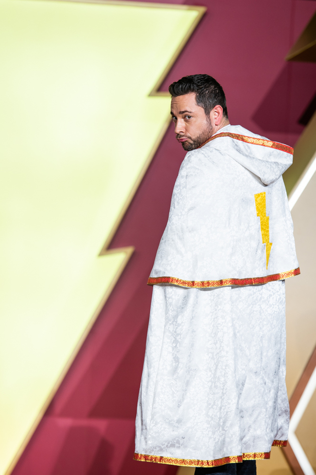 American actor Zachary Levi wears a combat-like uniform given by his fans as a gift at a promotional event of his upcoming film "Shazam" on Monday, March 25, 2019. [Photo provided to China Plus]