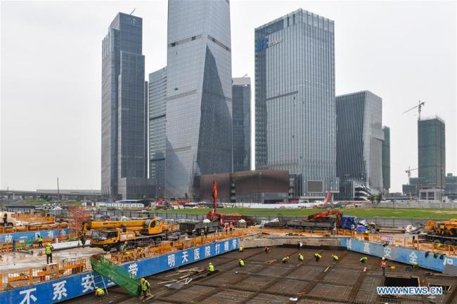 Constructors work on the site of a central cooling system in China (Guangdong) Pilot Free Trade Zone Qianhai & Shekou Area in Shenzhen, south China's Guangdong Province, March 15, 2019. [Photo: Xinhua/Liu Dawei]