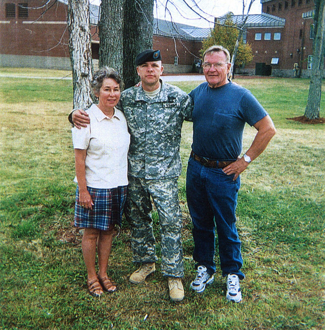 A photo of Army Staff Sergeant Travis Atkins with his parents. [Photo: U.S. Department of Defense]