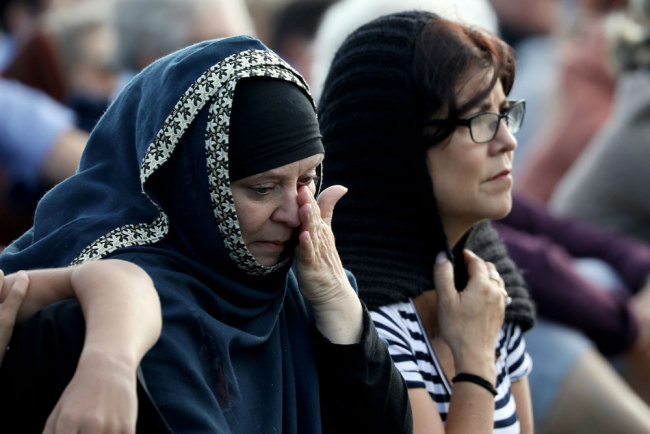 Members of the Muslim community attend the National Remembrance Service at North Hagley Park in Christchurch on March 29, 2019. The remembrance ceremony was held in memory of the 50 lives that were lost in the March 15th mosque shootings in Christchurch. [Photo: AFP/Sanka Vidanagama]