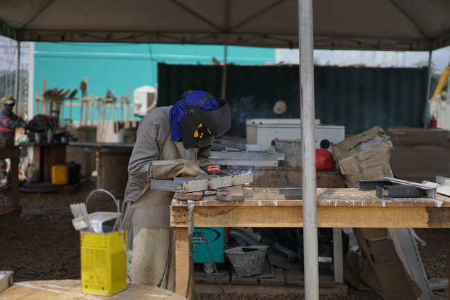 The file photo shows a Brazilian worker at the construction site of a major power grid project built by State Grid Corporation of China in Brazil.[Photo:China Plus]