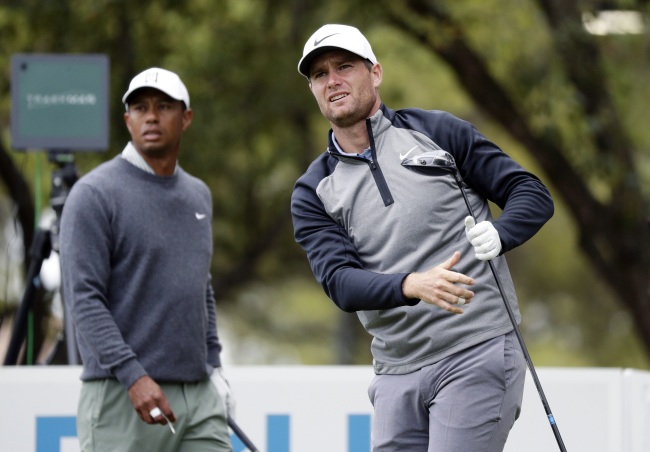 Lucas Bjerregaard, right, watches his drive on the eighth hole as Tiger Woods, left, looks on during quarterfinal play at the Dell Technologies Match Play Championship golf tournament, Saturday, March 30, 2019, in Austin, Texas. [Photo: AP/Eric Gay]