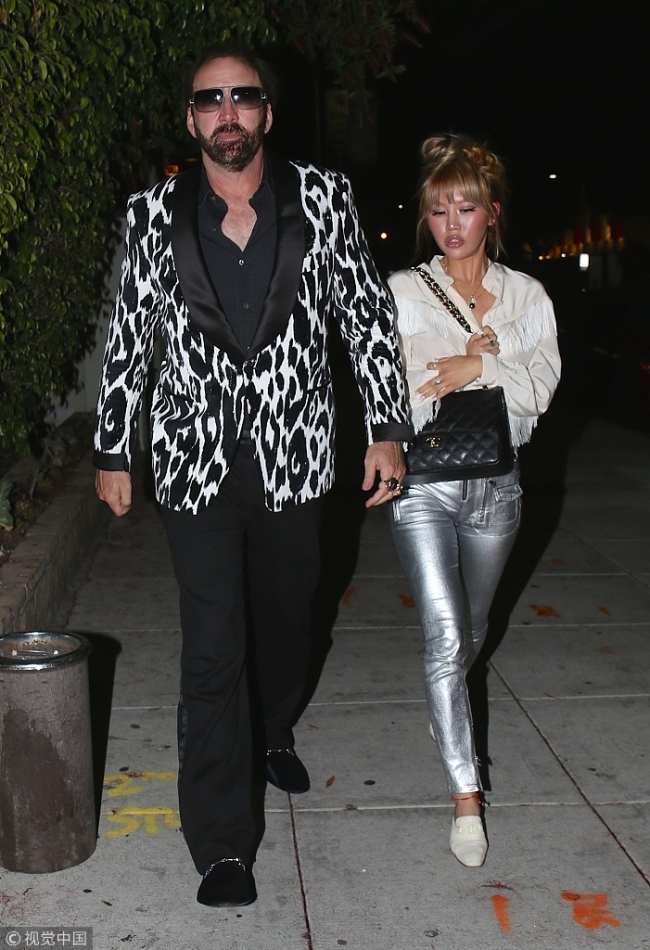 Actor Nicolas Cage rocked a zebra-print sportcoat after having dinner with girlfriend Erika Koike in Beverly Hills. [File Photo: VCG]
