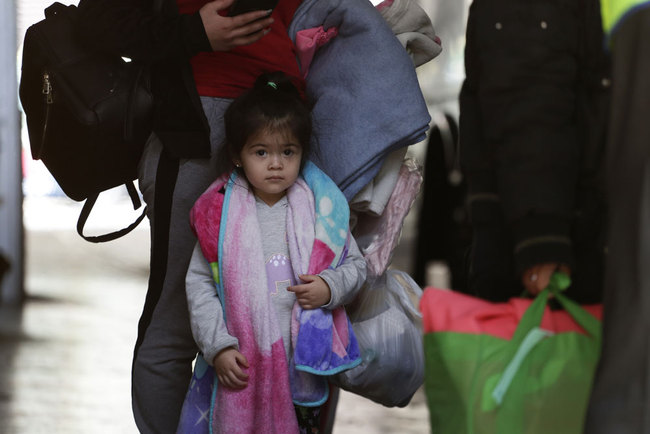 Immigrants from Central America seeking asylum board a bus, Tuesday, April 2, 2019, in downtown San Antonio. [Photo: AP/Eric Gay]