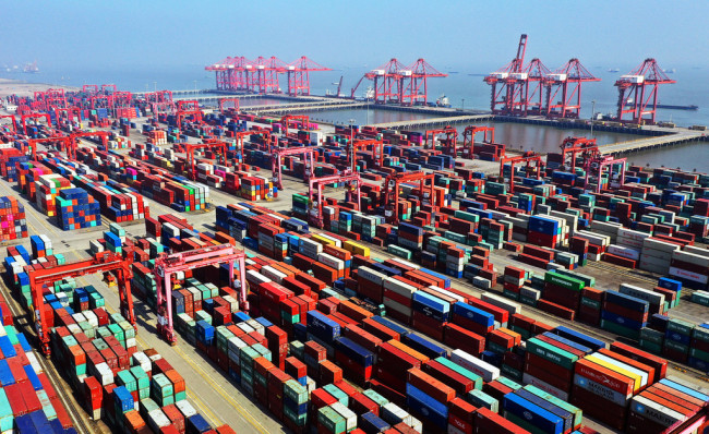 Containers are stacked at the fully automated container terminal at a port in Taicang city, east China's Jiangsu province, 19 March 2019. [Photo: IC]