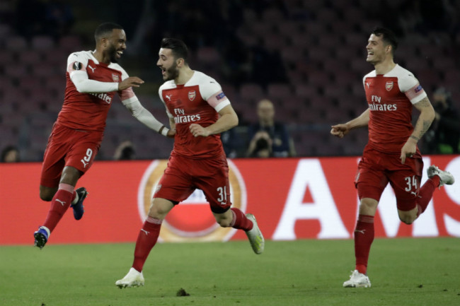 Arsenal's Alexandre Lacazette, left, celebrates with teammates after scoring his side's first goal during the Europa League second leg quarterfinal soccer match between Napoli and Arsenal at San Paolo stadium in Naples, Italy on Thursday, April 18, 2019. [Photo: AP]