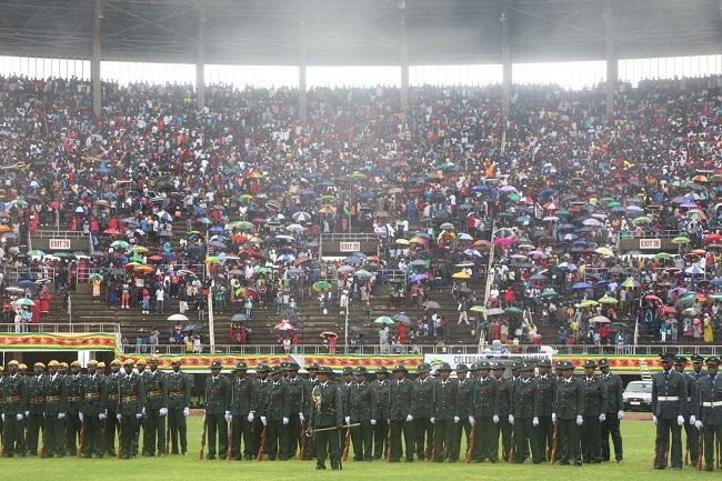 People are not bothered by heavy rains at the main event to celebrate the 39th anniversary of Zimbabwe’s Independence at the National Sports Stadium in Harare on Thursday, April 18, 2019. [Photo: China Plus]