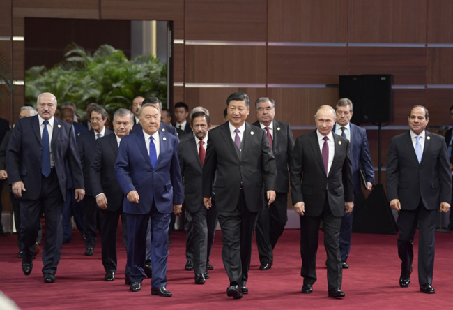President Xi Jinping and world leaders enter the conference room for the opening ceremony of the second Belt and Road Forum for International Cooperation on Friday, April 26, 2019. [Photo: Xinhua]