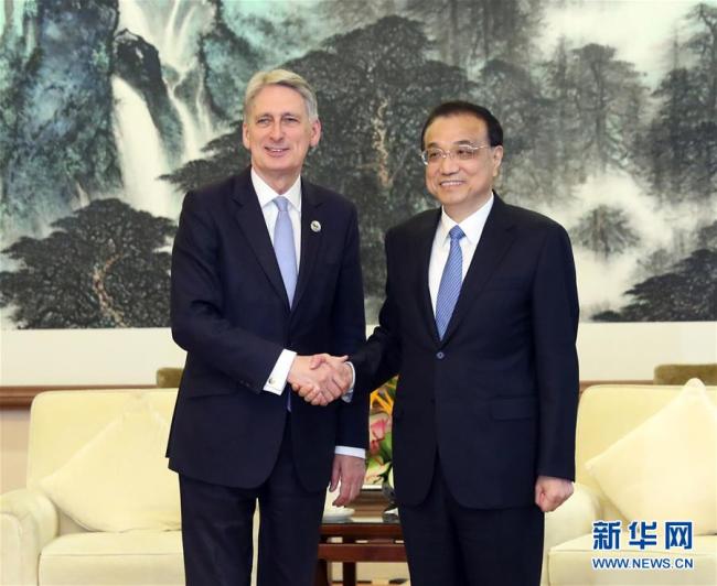 Chinese Premier Li Keqiang meets with British prime minister's special envoy and Chancellor of the Exchequer Philip Hammond, who is attending the Second Belt and Road Forum for International Cooperation, in Beijing, capital of China, April 26, 2019. [Photo: Xinhua]