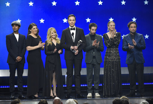 Kunal Nayyar, from left, Mayim Bialik, Melissa Rauch, Jim Parsons, Simon Helberg, Kaley Cuoco and Johnny Galecki, from the cast of "The Big Bang Theory," present the creative achievement award at the 24th annual Critics' Choice Awards on Sunday, Jan. 13, 2019, at the Barker Hangar in Santa Monica, Calif. [Photo: AP]