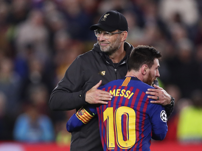 Barcelona's Lionel Messi, who scored two of the team's three goals, hugs Liverpool coach Juergen Klopp after the Champions League semifinal first leg soccer match between FC Barcelona and Liverpool at the Camp Nou stadium in Barcelona, Spain, Wednesday, May 1, 2019. [Photo: AP/Manu Fernandez]