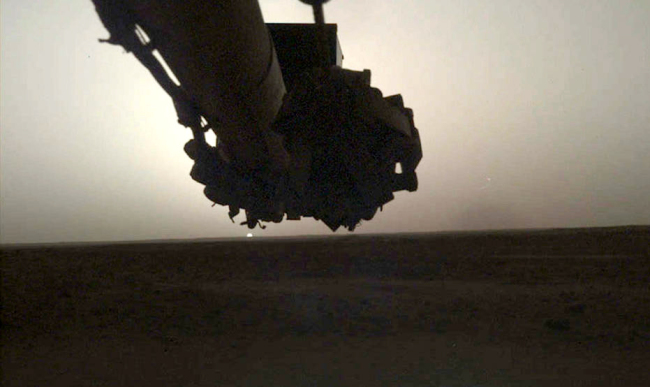 NASA's InSight lander used its Instrument Deployment Camera (IDC) on the spacecraft's robotic arm to image this sunrise on Mars on April 24, 2019, the 145th Martian day (or sol) of the mission. This was taken around 5:30 a.m. Mars local time. [Photo: nasa.gov]