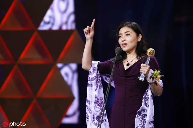 Yan Nieng delivers a speech after receiving an award at the You Bring Charm to the World Award Ceremony in Beijing, China on March 31, 2017. [Photo: IC] 