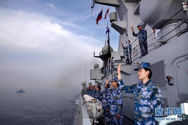 Chinese naval soldiers wave goodbye to their Russian counterparts on the sea off Qingdao, east China's Shandong Province, on May 4, 2019. [Photo: Xinhua]