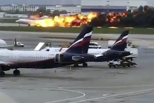 This image taken from video provided by Instagram user @artempetrovich, shows the SSJ-100 aircraft of Aeroflot Airlines on fire during an emergency landing in Sheremetyevo airport in Moscow, Russia, Sunday, May 5, 2019. [Photo: @artempetrovich via AP]