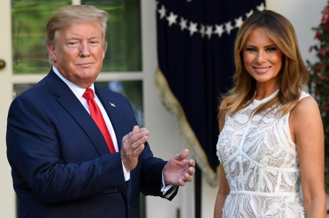 U.S. President Donald Trump alongside First Lady Melania Trump smile during the Presidential Medal of Freedom ceremony for US golfer Tiger Woods in the Rose Garden of the White House in Washington, DC, on May 6, 2019. [Photo: AFP]