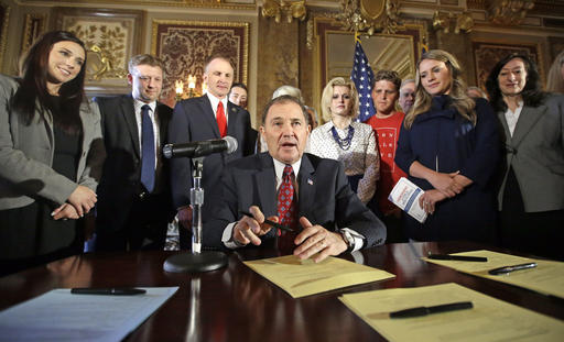 In this April 19, 2016, file photo, Utah Gov. Gary Herbert looks up during a ceremonial signing of a state resolution declaring pornography a public health crisis, at the Utah State Capitol, in Salt Lake City.[Photo: AP]
