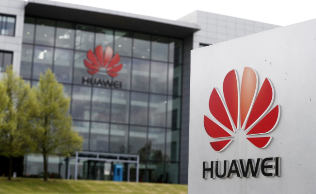 A logo of Huawei and signage at the company’s main UK offices in Reading, west of London, on April 29, 2019. [Photo: AFP]