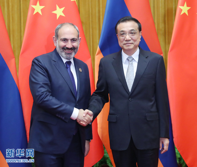 Chinese Premier Li Keqiang meets with Armenian Prime Minister Nikol Pashinyan at the Great Hall of the People in Beijing, May 15. [Photo: Xinhua]