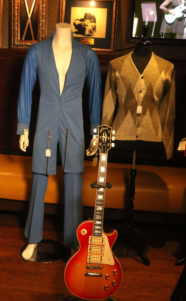 James Brown's jump suit, Kurt Cobain's Sweater, and Ace Frehley's guitar are seen on May 13, 2019 in New York at the press preview for the upcoming 'Music Icons' sale held by Julien's Auctions at the Hard Rock Café. [Photo: IC]