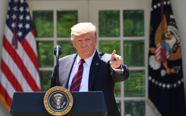US President Donald Trump gestures as he delivers remarks on immigration at the Rose Garden of the White House in Washington, DC on May 16, 2019.[Photo: AFP]