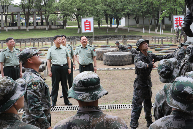 President Xi Jinping, also general secretary of the Communist Party of China Central Committee and chairman of the Central Military Commission, inspects the Army Infantry College of the People's Liberation Army in east China's Jiangxi Province on May 21, 2019. [Photo: Xinhua]