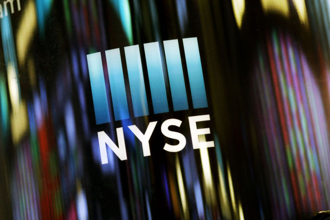In this May 13, 2019 file photo, the NYSE logo is displayed at the New York Stock Exchange. [File photo: AP/Mark Lennihan]