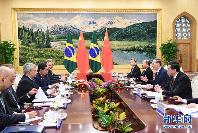 Chinese vice president Wang Qishan meets with Brazil's Vice President Hamilton Mourao in Beijing on Thursday, May 23, 2019. They co-chaired the fifth meeting of the China-Brazil High-Level Coordination and Cooperation Committee (COSBAN). [Photo: Xinhua]