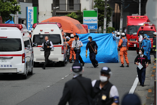 A general view shows multiple police cars, ambulances and fire engines at a crime scene where a man stabbed 19 people, including children in Kawasaki on May 28, 2019. [Photo: JIJI PRESS / AFP]