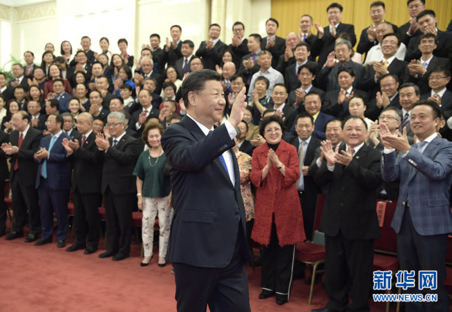 President Xi Jinping meets with overseas Chinese representatives who are in Beijing to attend the ninth Conference for Friendship of Overseas Chinese Associations and a plenary session of the board of directors of the China Overseas Friendship Association on May 28, 2019. [Photo: Xinhua]