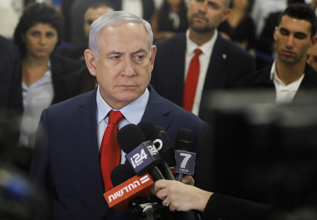 Israeli Prime Minister Benjamin Netanyahu talks to the press following a vote on a bill to dissolve the Knesset (Israeli parliament) on May 29, 2019, at the Knesset in Jerusalem. Parliament voted 74-45 in favour of dissolving itself and setting elections for September 17. [Photo: AFP/Menahem Kahana]