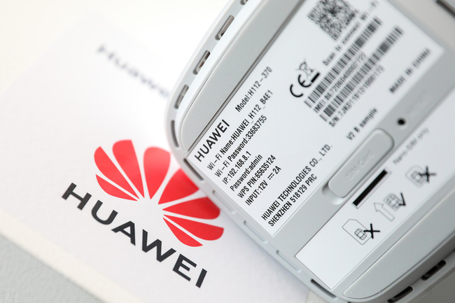 Information sits on the base of a 5G CPE (customer-premises equipment) Pro router, manufactured by Huawei Technologies Co., following a news conference announcing the rollout of BT Group Plc's EE 5G network in London, U.K., on Wednesday, May 22, 2019. [Photo: VCG]