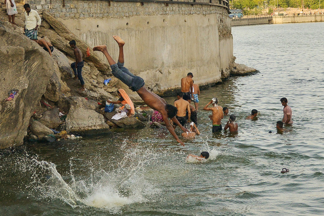 In this file photo taken on May 31, 2019, Indian youth dive into the Ana Sagar lake during a hot day in Ajmer, in the Indian state of Rjasthan. [Photo: AFP]