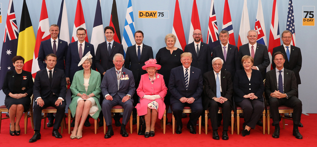 (back row L-R) Slovakian Deputy Prime Minister Richard Rasi, Polish Prime Minister Mateusz Morawiecki, Canadian Prime Minister Justin Trudeau, Luxembourg's Prime Minister Xavier Bettel, Norwegian Prime Minister Erna Solberg, Belgian Prime Minister Charles Michel, Czech Prime Minister Andrej Babis, Australian Prime Minister Scott Morrison, Danish Ambassador to the UK Lars Thuesen (front row L-R) New Zealand's Governor-General Patsy Reddy, French President Emmanuel Macron, Britain's Prime Minister Theresa May, Britain's Prince Charles, Prince of Wales, Britain's Queen Elizabeth II, US President Donald Trump, Greek President Prokopis Pavlopoulos, German Chancellor Angela Merkel and Dutch Prime Minister Mark Rutte pose for the official family photograph during an event to commemorate the 75th anniversary of the D-Day landings, in Portsmouth, southern England, on June 5, 2019. [Photo: Pool/AFP/Jack Hill]