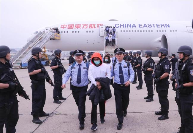 Suspects arrive in Beijing on June 7, 2019. [Photo: Xinhua]