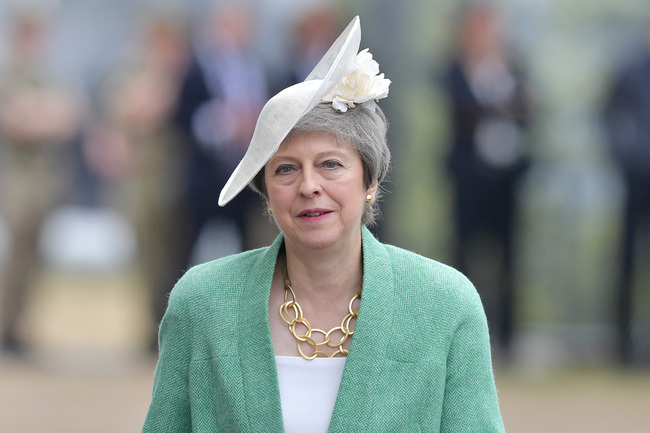 Britain's Prime Minister Theresa May returns to her seat after speaking during an event to commemorate the 75th anniversary of the D-Day landings, in Portsmouth, southern England, on June 5, 2019. [Photo: AFP]