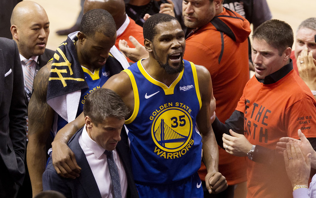 Golden State Warriors forward Kevin Durant (35) reacts as he leaves the court after sustaining an injury during first-half basketball action against the Toronto Raptors in Game 5 of the NBA Finals in Toronto, Monday, June 10, 2019. [Photo: Chris Young/The Canadian Press via IC] 