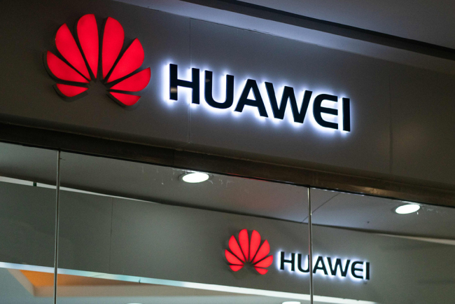 A Huawei logo is displayed at a retail store in Beijing on May 23, 2019. [File photo: VCG]