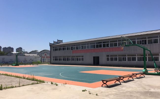 Specially built dormitories and facilities like a basketball court at the Feixi Precast Box Girder Factory are in contrast to the filthy and poor living conditions migrants workers are often subjected to. [Photo: Chinaplus]