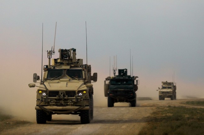 Military vehicles with the US-backed coalition against the Islamic State (IS) group are pictured during an operation to expel the jihadists, in the countryside of the eastern Syrian province of Deir Ezzor on February 21, 2019. [Photo: AFP]