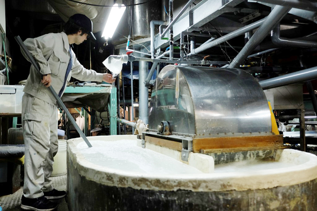 This picture taken on March 15, 2019 shows a worker checking the "washi" paper manufacturing process at the Hidaka Washi factory in Hidaka, Kochi prefecture, some 640 kilometers southwest of Tokyo. [Photo: AFP]