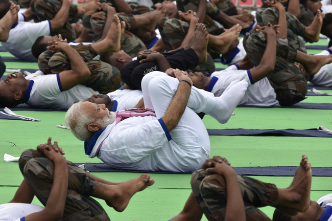 Indian Prime Minister Narendra Modi performs yoga during a mass yoga event on International Yoga Day in Ranchi in eastern Jharkhand state June 21, 2019. [Photo: AFP/Rajesh Kumar]