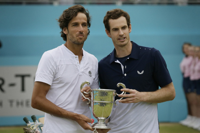 Andy Murray of Britain, left, celebrates with Feliciano Lopez of Spain after winning their men's doubles final tennis match against Joe Salisbury of Britain and Rajeev Ram of the United States at the Queens Club tennis tournament in London, Sunday June 23, 2019. [Photo: IC]