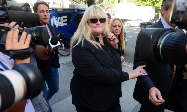 Michael Jackson's ex-wife Debbie Rowe arrives at court on Los Angeles on August 15, 2013, in the ongoing trial of a negligence lawsuit filed by the late singer's mother against concert promoter AEG Live. Rowe, 54, the mother of Jackson's two oldest children, testified a day earlier that three doctors were "competing'' in the early 1990s to treat Jackson, taking advantage of his overwhelming fear of pain to prescribe a host of narcotics while he was treated for a range of medical problems. [Photo: AFP/ Frederic J. BROWN]