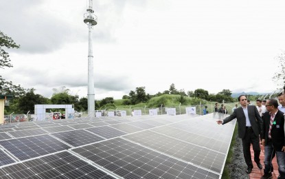 Officials inspect the 46-kilowatt "peak" centralized solar power system in Sitio New Baliwet, San Marcelino town in Zambales after its turnover on Thursday, June 27, 2019. The State Grid Corp. of China also supplied similar equipment to Old Baliwet last May. [Photo: PNA/Oliver Marquez]