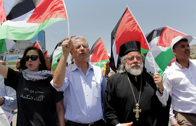 Palestinian protesters shot slogans during a protest against the Bahrain economic workshop, near the Jewish settlement of Beit El close to the West Bank city of Ramallah, June 25, 2019. [Photo: IC]