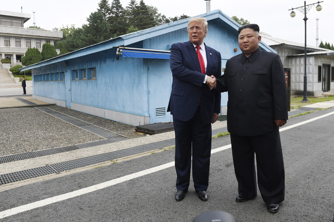 DPRK leader Kim Jong Un shakes hands with US President Donald Trump south of the Military Demarcation Line that divides North and South Korea, in the Joint Security Area (JSA) of Panmunjom in the Demilitarized zone (DMZ) on June 30, 2019. [Photo: AP]