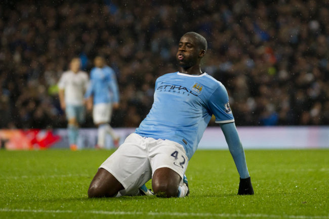 Manchester City's Yaya Toure celebrates after scoring against West Ham during their English League Cup semi-final soccer match at the Etihad Stadium, Manchester, England, Wednesday Jan. 8, 2014. [File photo: IC]